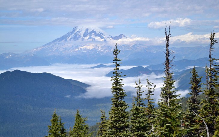 Distant Mount Rainier shrouded in clouds, not far from the Chinook Pass trailhead