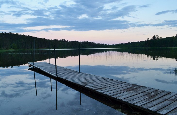 A boat dock basking in dusk at Itasca State Park