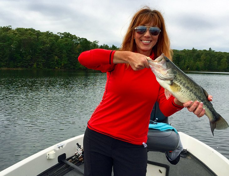 Anietra holding a bass on the Clear Fork Reservoir