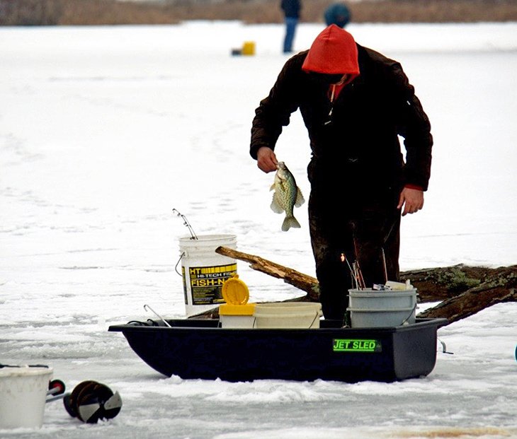 Fisherman with crappie on Indian Lake