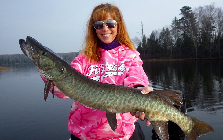 Anietra holding a musky on Big Saint Germain Lake