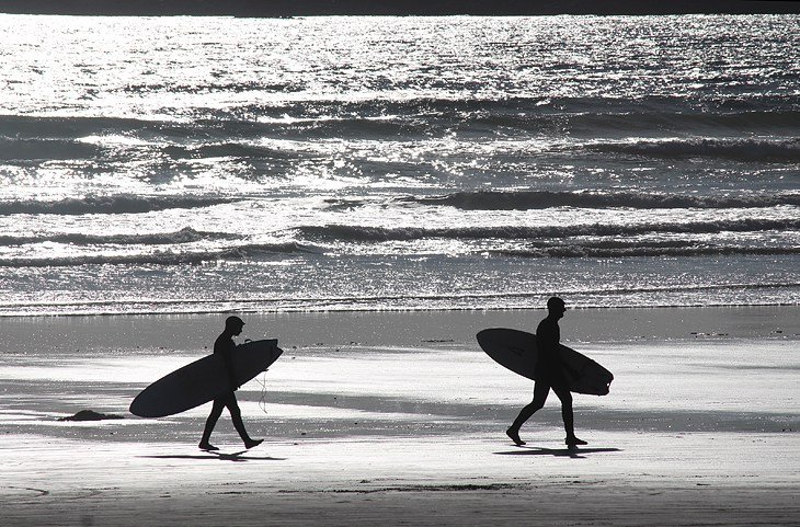 Surfers on Cox Bay