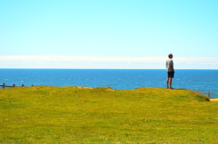 A visitor enjoying the view at Boiler Bay