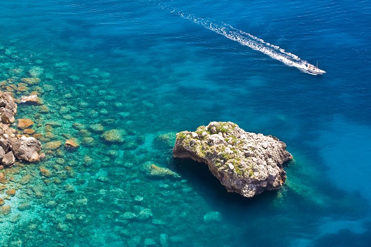 Water taxi gliding over the crystal-clear waters of Capri