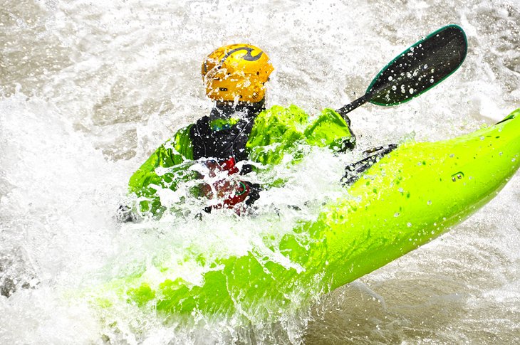 Kayaking white water rapids