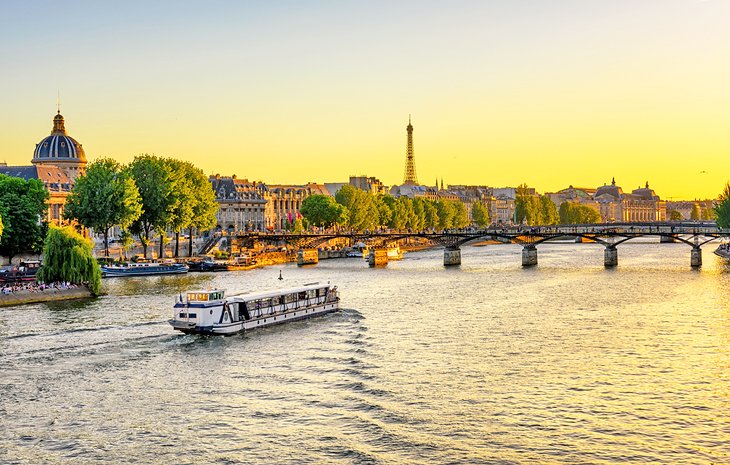 Seine river cruise at sunset Tourist Attractions in Paris