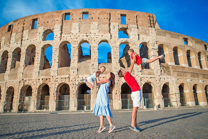 A family in front of the Colosseum