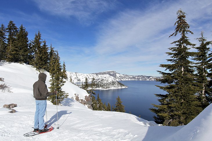 Snowshoer overlooking Crater Lake