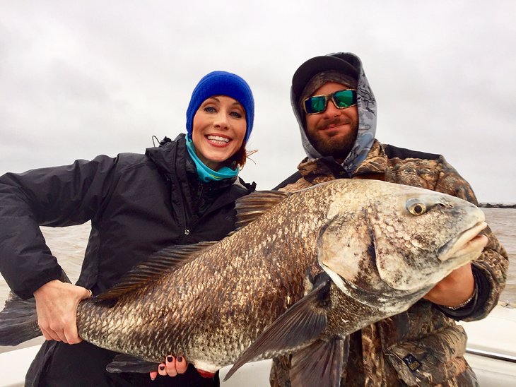 Anietra catching a black drum near Galveston