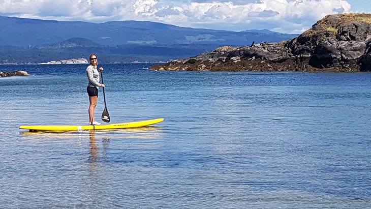 Lana stand up paddleboarding on Vancouver Island