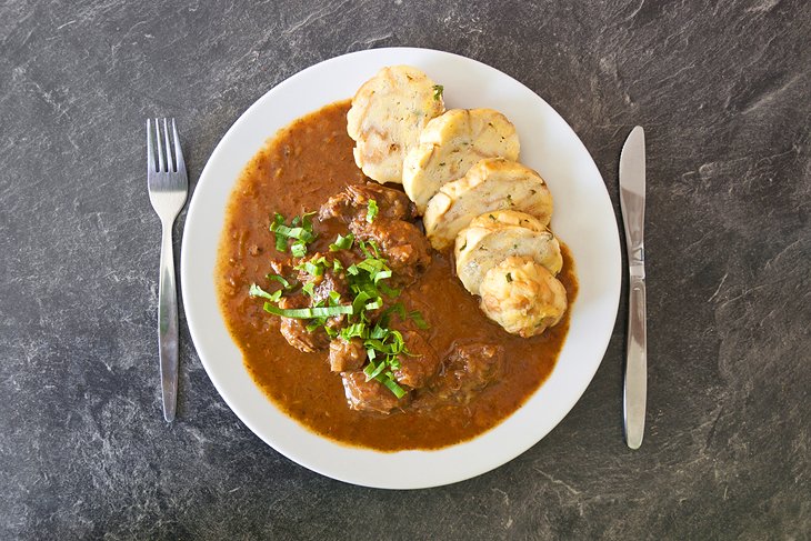 Traditional Czech meal of beef goulash and dumplings