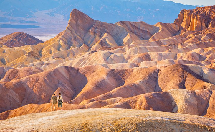 Hikers admiring the surreal landscape of Death Valley National Park