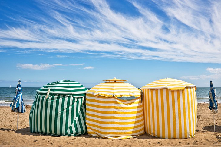 Striped beach tents at the Plage de Deauville