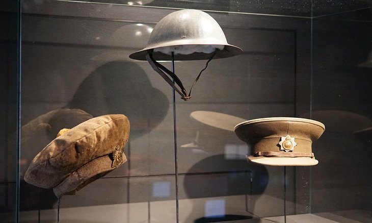 Military hat exhibit at the Mons Memorial Museum