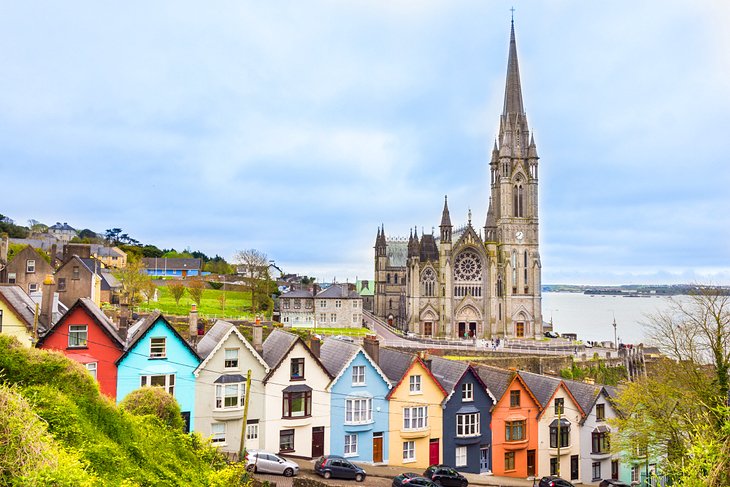 Colorful houses in front of the Cobh Cathedral