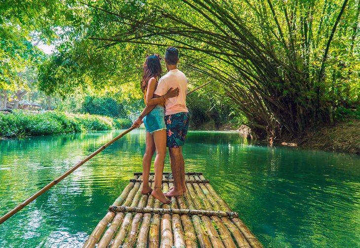 A couple on a bamboo raft on the Martha Brae