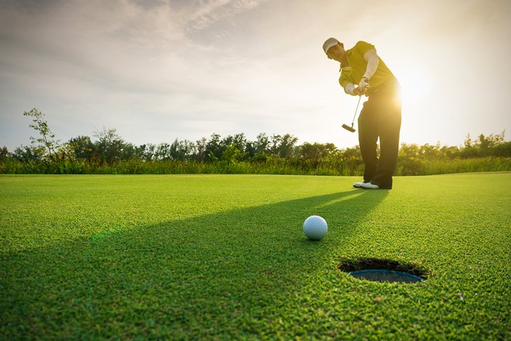 Golfer in the late afternoon