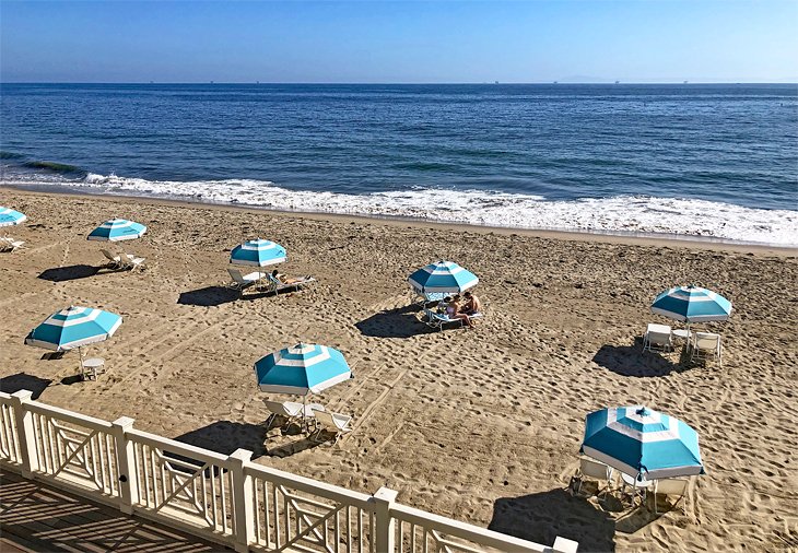 Beach umbrellas fronting the Rosewood Miramar Beach