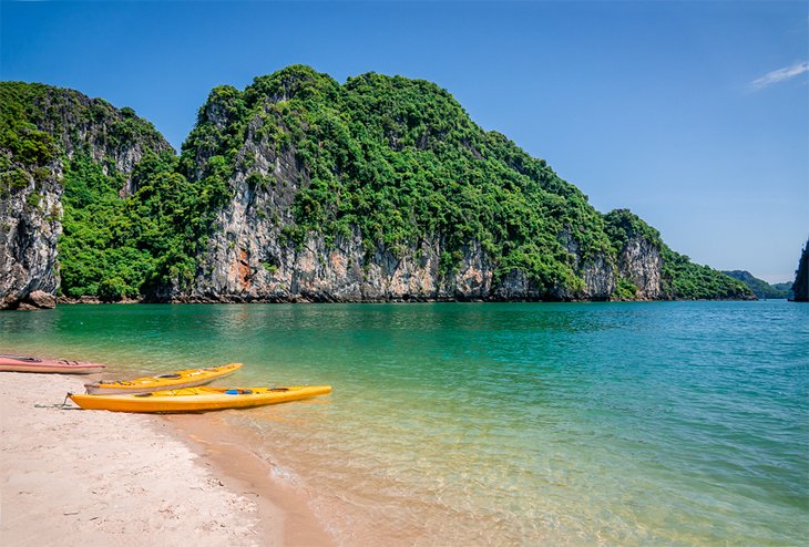 Kayaks on the beach in Bai Tu Long Bay
