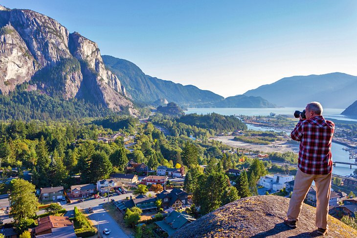 Hiker photographing the Stawamus Chief from Smoke Bluffs Park