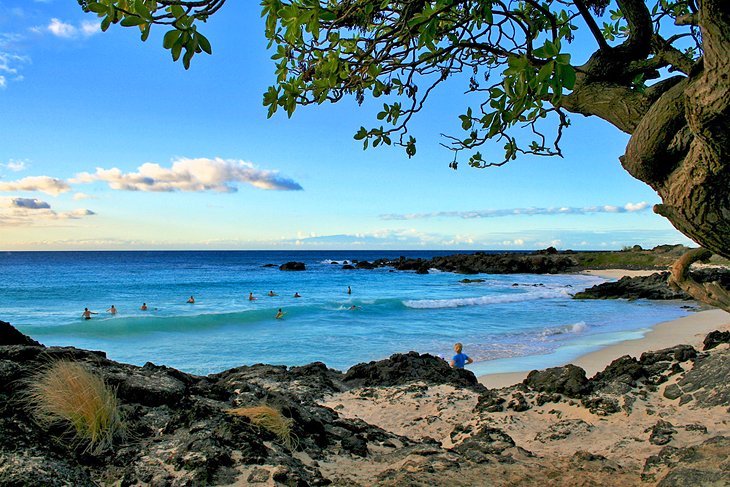 Surfers on Manini'owali Beach