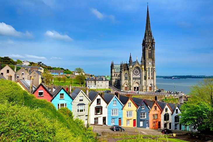 Colorful houses in front of St. Colman's Cathedral in Cobh