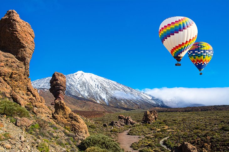 Hot air balloons with the snowcapped Teide Volcano in Teide National Park, Tenerife