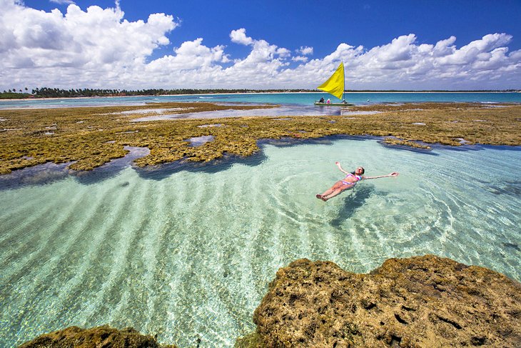 Woman swimming in a natural pool at Porto de Galinhas