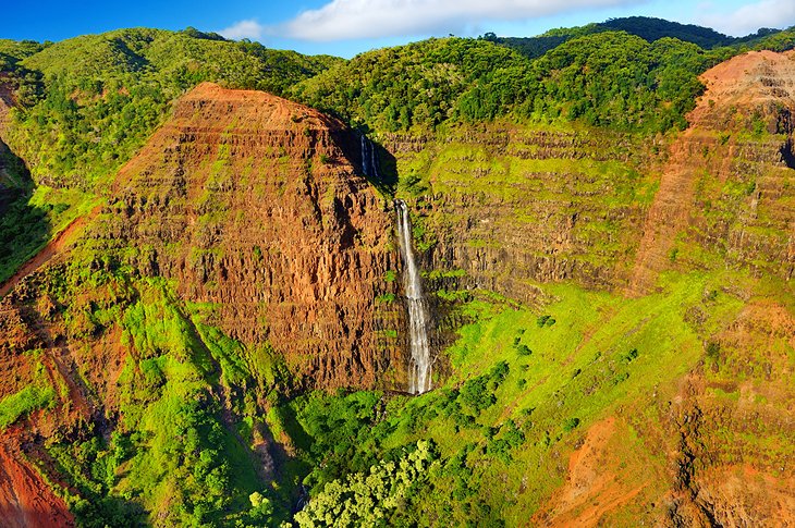 Beautiful waterfall in lush Waimea Canyon