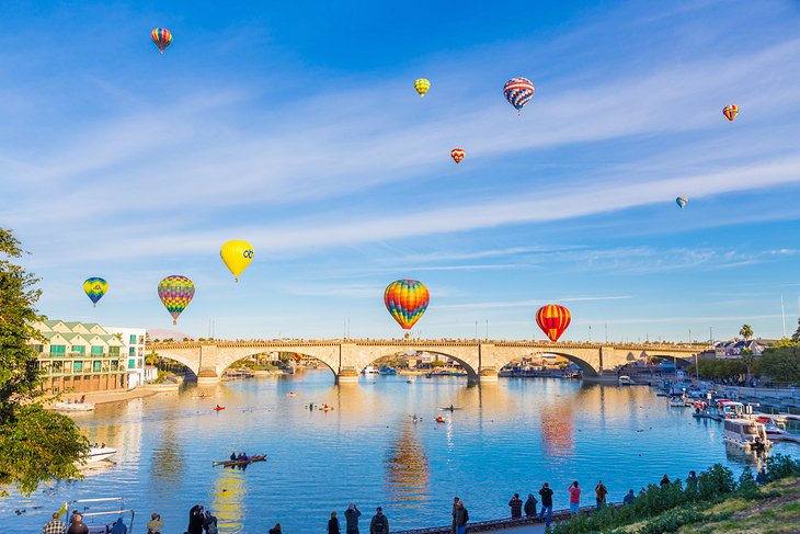 London Bridge spanning Lake Havasu with hot air balloons