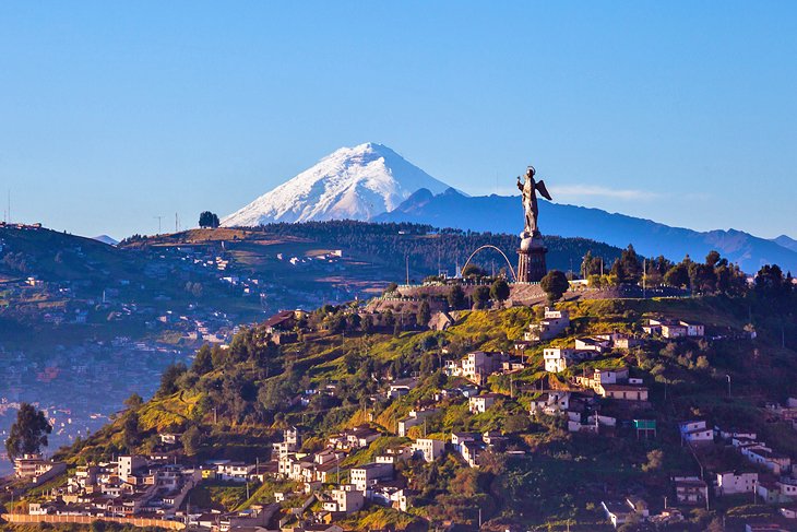 El Panecillo statue with the Cotopaxi volcano in the distance
