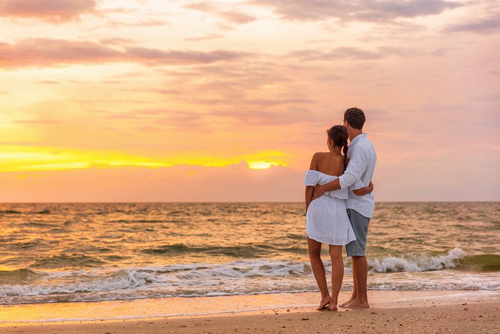 Honeymoon couple enjoying the sunset at Lover's Key
