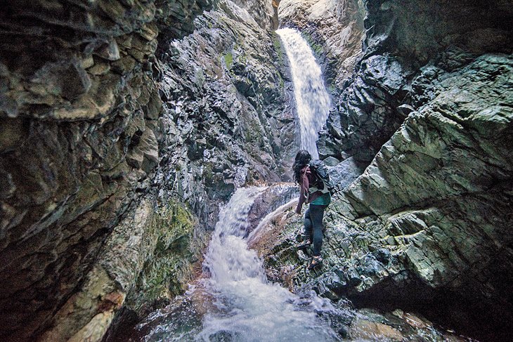 A hiker exploring Zapata Falls