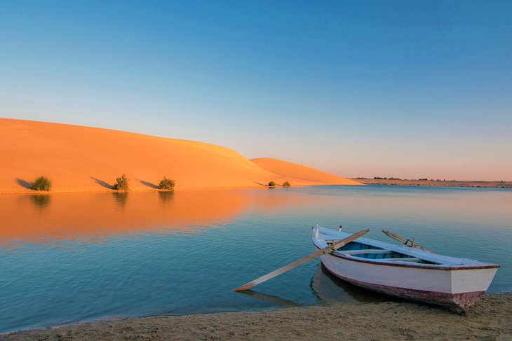 Boat and sand dunes at Fayoum's Magic Lake