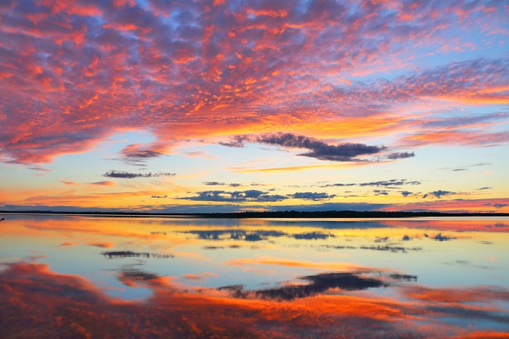 Midnight sun reflection on Lake Inari