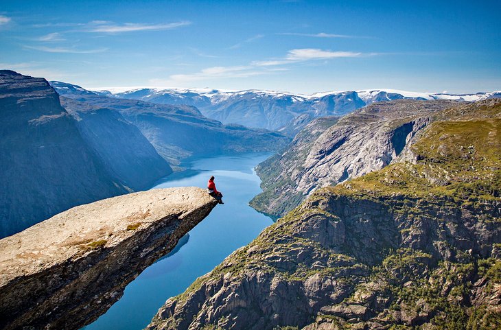 Hiker sitting on the Trolltunga