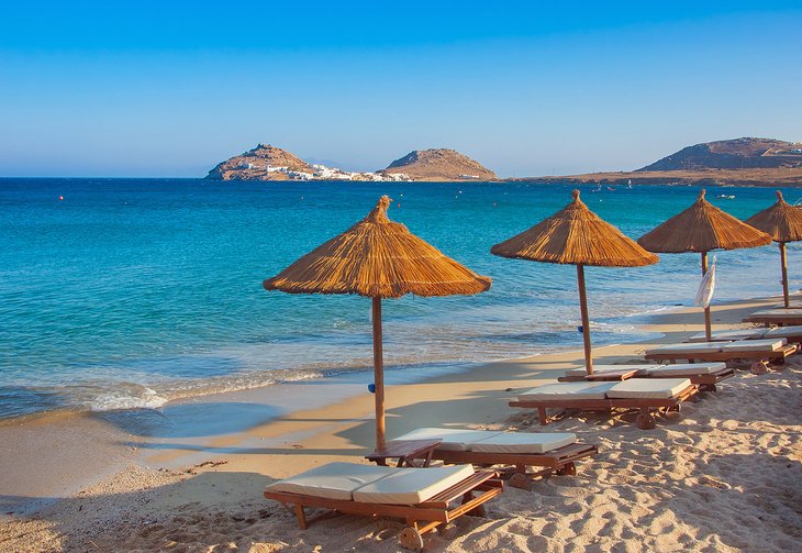 Umbrellas and lounges on the beach at Mykonos