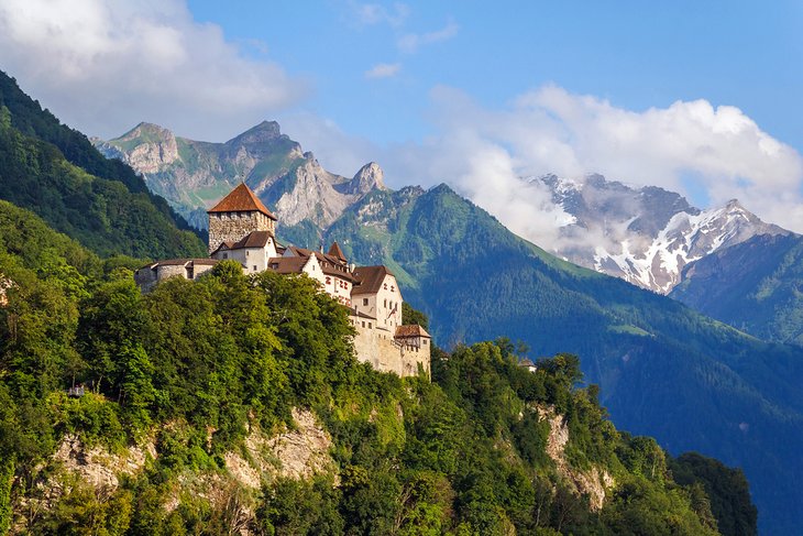 Vaduz Castle with snow-covered peaks in the distance