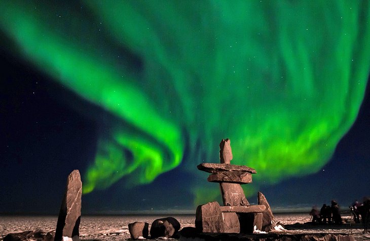 Stone Inuit structure with the northern lights above in Churchill, Canada