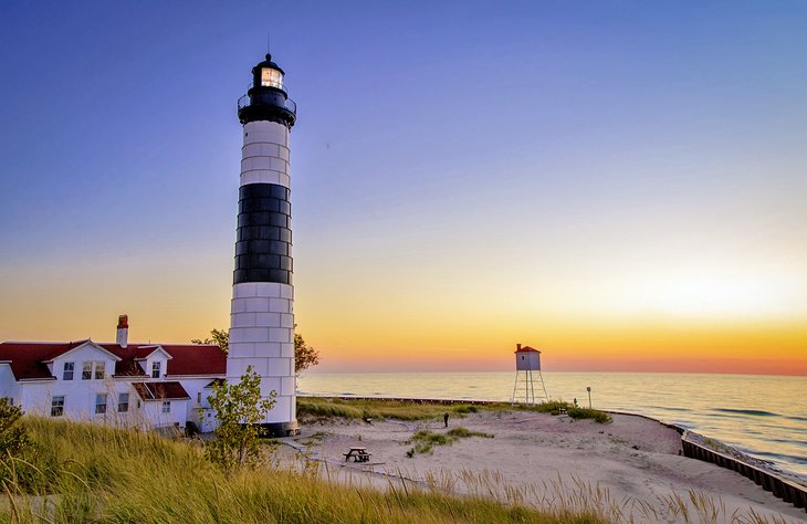 Big Sable Lighthouse on the shores of Lake Michigan at sunset
