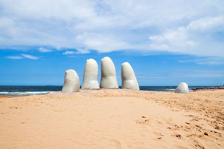 Hand sculpture on the beach at Punta del Este
