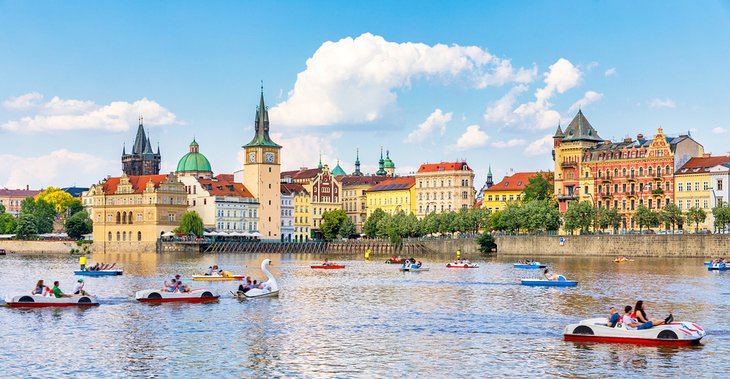 Families in pedal boats on the Vltava River