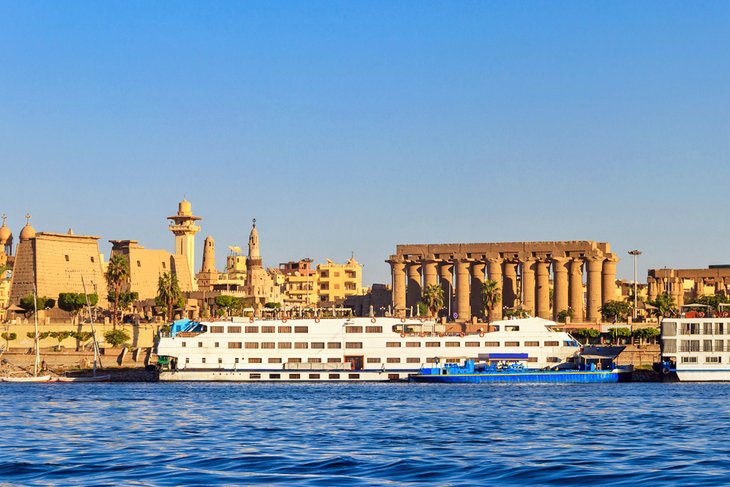 Nile cruisers docked in front of Luxor Temple