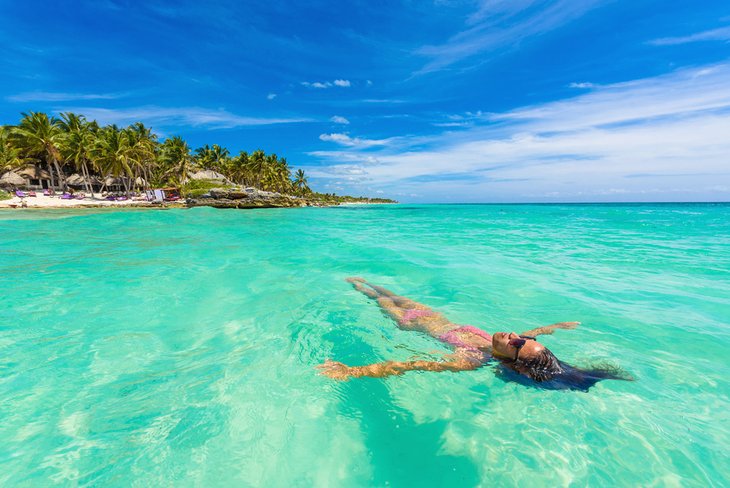 Floating in the jade-green waters off Tulum