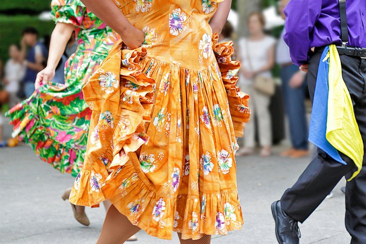 Dancers wearing traditional outfits at a festival in Puerto Rico