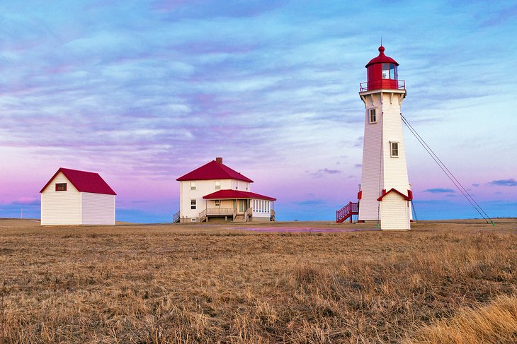 Anse-à-la-Cabane lighthouse at sunset on Havre Aubert Island