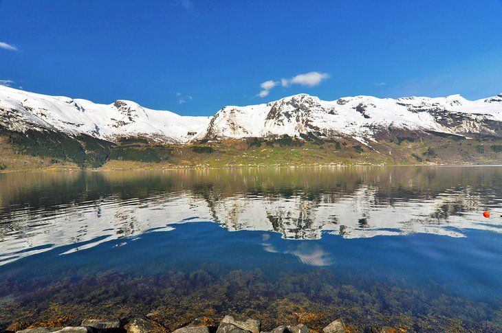 Europe's Top Lakes In 2023 Snowcapped mountains surrounding Hornindalsvatnet