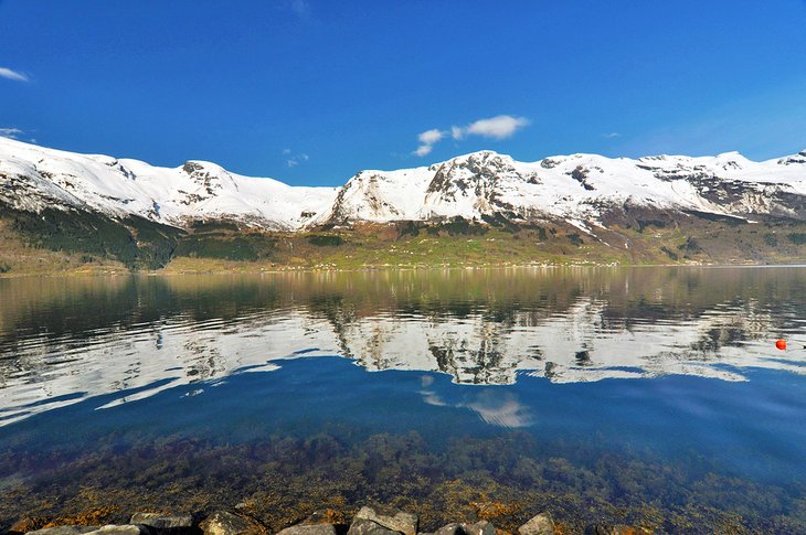 Snowcapped mountains surrounding Hornindalsvatnet