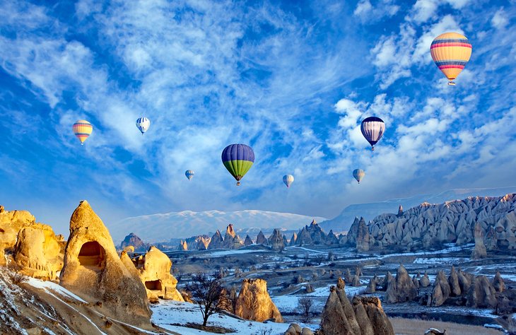 Balloons over Cappadocia’s snow-covered valleys