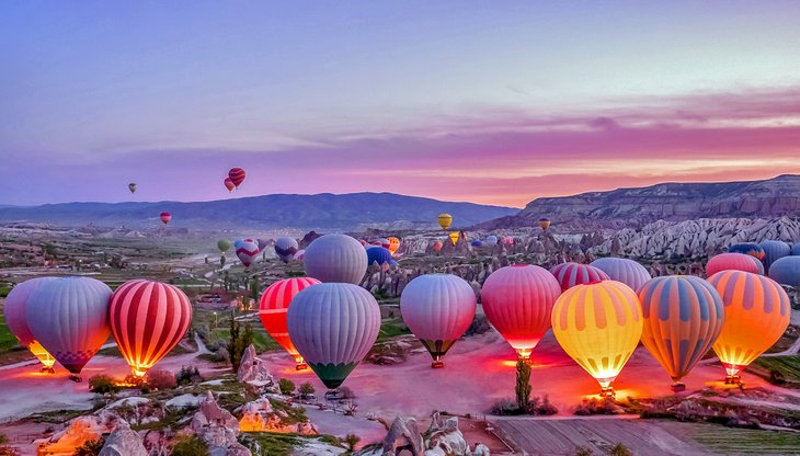 Hot air balloons preparing for an early morning departure in Cappadocia